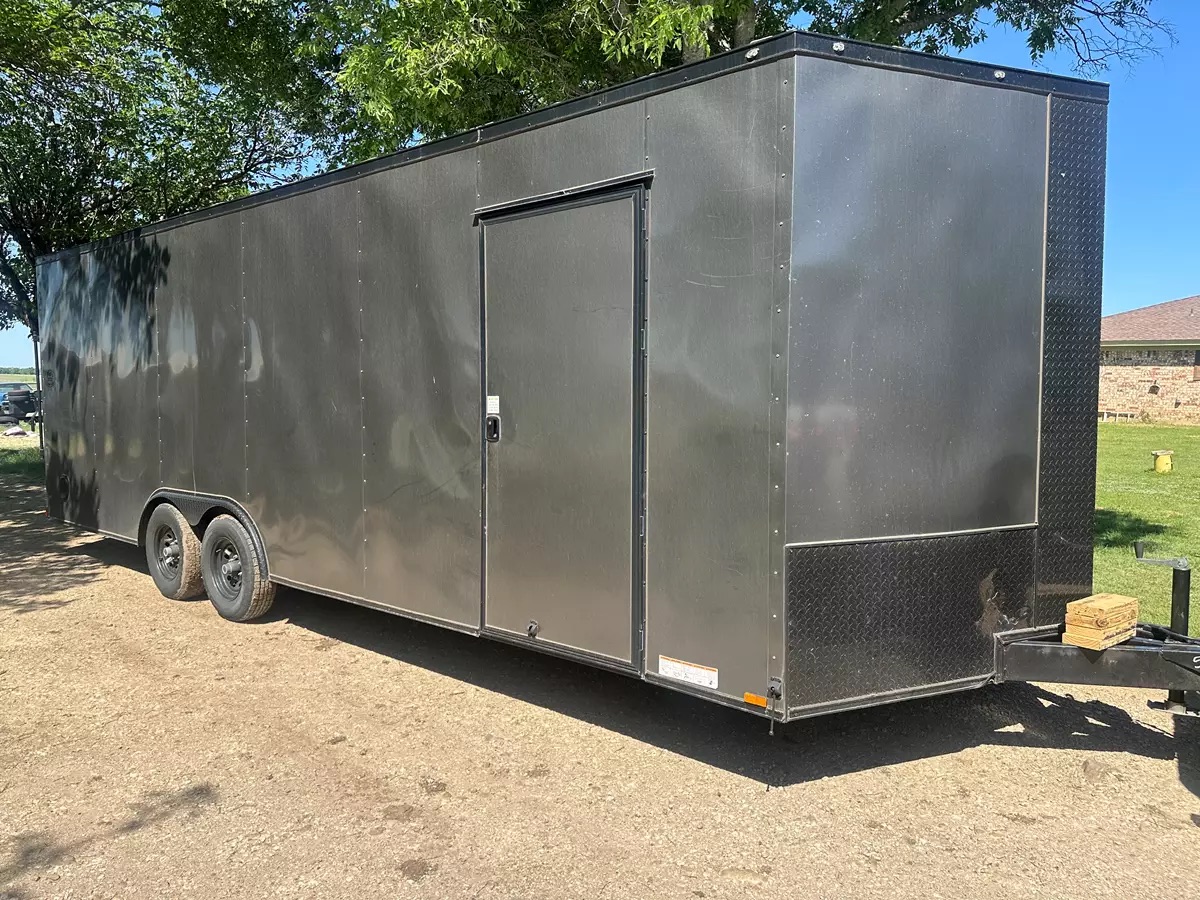 Large grey enclosed trailer ready for hauling